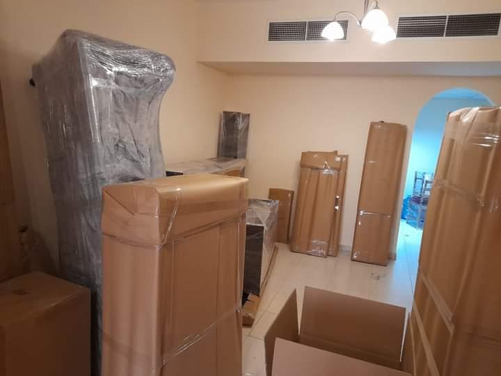 Villa room packed with wrapped furniture — Emirates Movers Dubai