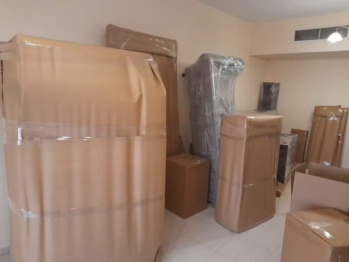 Packed room with furniture wrapped and ready for moving Dubai UAE