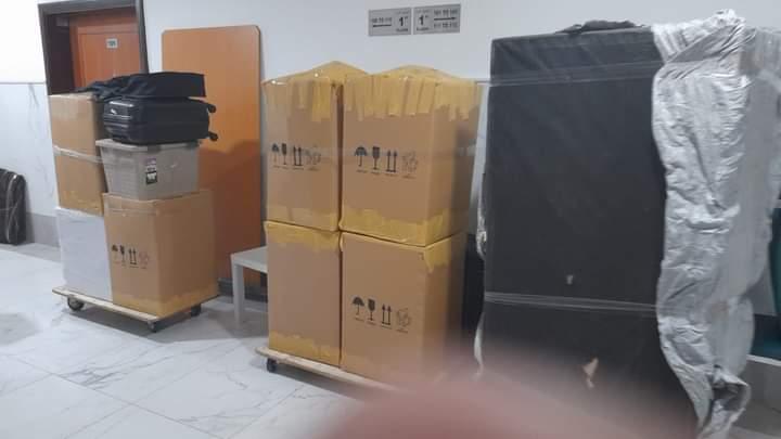 Moving boxes on trolleys ready for transport — movers Dubai UAE