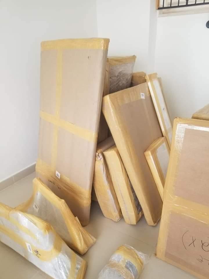 Flat items wrapped in cardboard — professional packing Emirates Movers